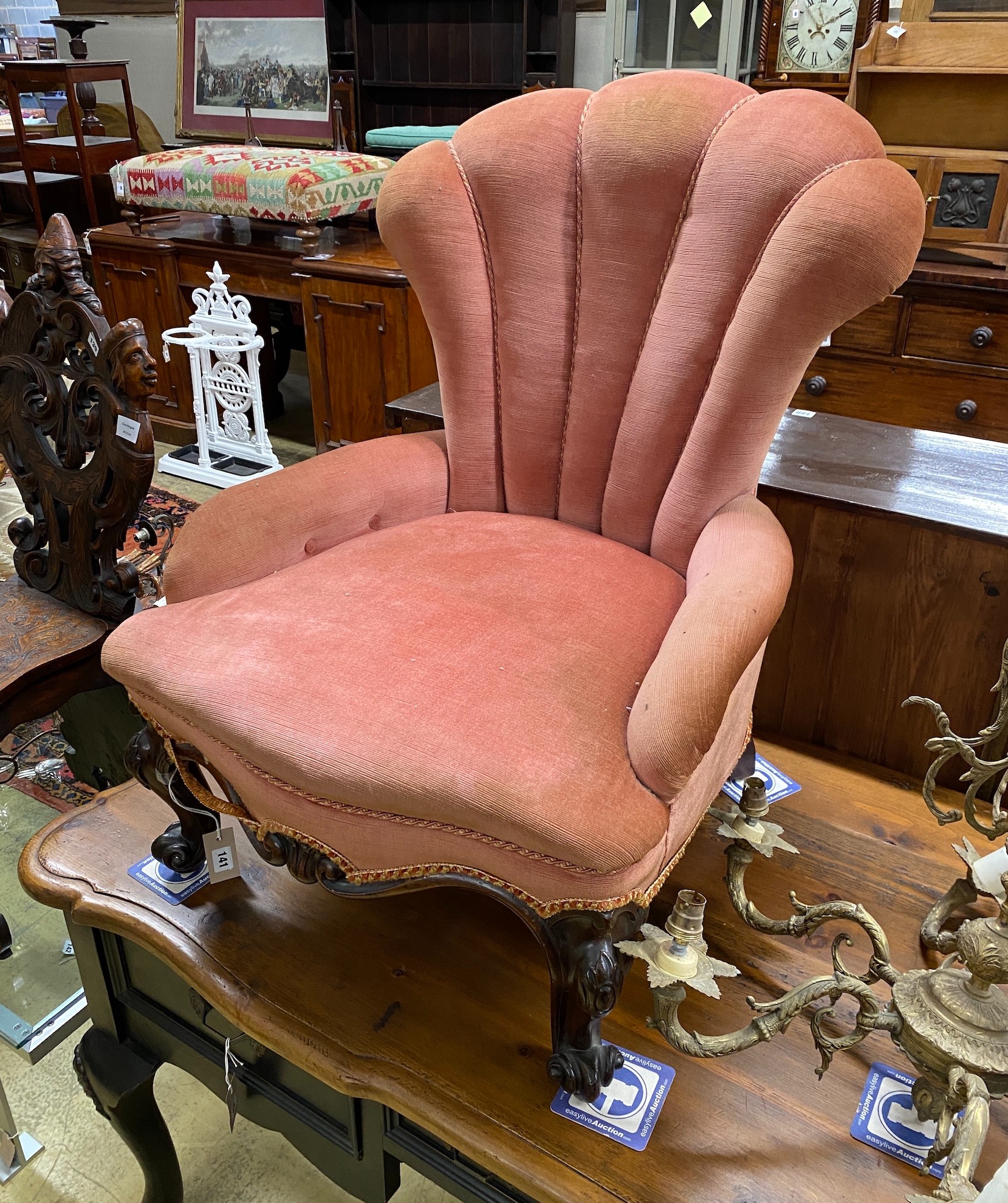 A Victorian mahogany spoon back nursing chair, width 63cm, depth 55cm, height 86cm